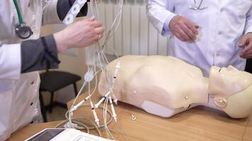 Training with medical dummy. Close up view of training medical procedure video
