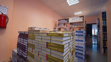 Shot inside the university library. View of books organized in shelves in big medical university video