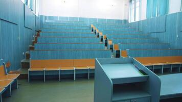 Auditorium For Lectures At University. Empty auditorium with wooden desks and chairs video