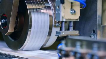 A factory for the production of diapers. Production of a large batch of diapers on a special machine video