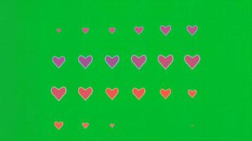 Colorful hearts in rows arranged on a green background with soft animation. Love concept video