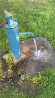 Iron column with water flowing out of it video