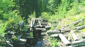Wooden dam and river stream close up, wooden splashing environment, splash picturesque dam, river stream, close up flowing video