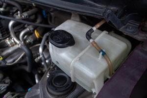 A tube of car window washer fluid. The wiper fluid tube for the windshield. photo