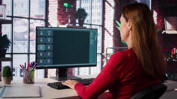 Focused woman working with an AI chatbot on her desktop computer, offering real time assistance and powerful online tools. Advanced system displays how machine learning provides support. Camera B. video