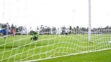 Dynamic Youth Soccer Action. Focused Goal Net with Blurred Background video