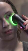 LED Facial Device in Action. Modern Skincare Routine in Front of Mirror video