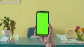 Smartphone Green Screen Display Open on Yellow Background Mock up. Empty Green phone for Call, Website Template News or Game Applications. One Blank Technology Zoom video