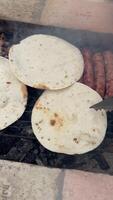 ugc barbecue grilling meat and pita bread on a vertical user generated video