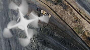 Above A UAV Quadcopter Drone Flying Slow Motion Outdoors Above A Construction Site With Excavation Grading Equipment. video