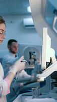 Medical development research laboratory, chemist or science scientist student hand in glove, drop water into pipette for test analysis liquid sample in clinic lab. Analysing for medicine. Vertical video