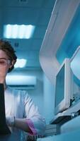Scientist, portrait of woman in lab for research, experiment or chemical test. Medical, study and biochemist with confidence for investigation, molecule structure. Vertical video