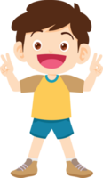 A smiling boy in shorts stands with two fingers raised in a confident manner. png