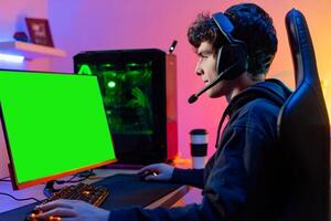 Young man using game streaming service on PC photo