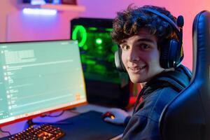 Happy gamer chatting on computer photo