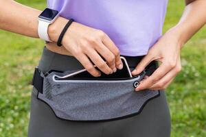 Runner woman getting pack ready for running photo