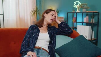 Sick ill Caucasian woman suffering from headache problem, tension and migraine grimacing in pain video