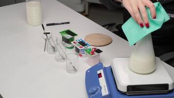 Laboratory experiment with milk in a flask video