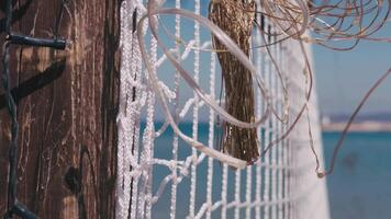 A Detail of Net Hanging on the Gazebo and the Sea video