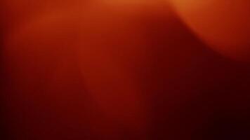 A red and orange background with a blurry image video