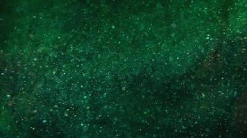 green particle system spinning in low motion video