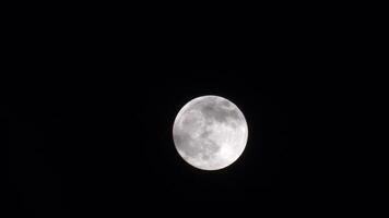 full mon time lapse at night with clouds covering the moon video