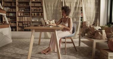 Female working in own store of organic products video