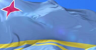 Aruba flag waving at wind in slow with blue sky, loop video