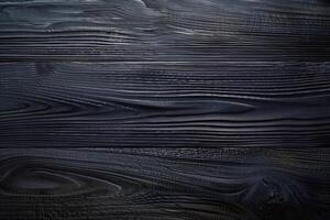 Dark, textured wooden planks with a smooth finish, showcasing natural grain patterns and a rich black color. photo