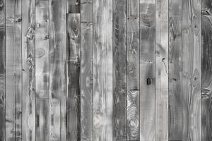 Rustic gray wooden wall featuring a mix of gray and brown tones, showcasing the natural grain and texture of the wood. photo