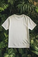 A white t - shirt on a green background photo