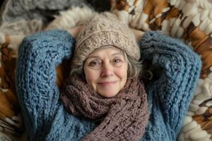 An older woman in a knitted hat and scarf photo