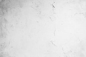 Seamless textured white wall with subtle imperfections and cracks, creating a minimalist and clean background. photo