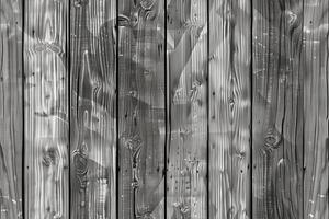 Wooden gray planks with a textured surface, featuring a monochromatic color scheme. The wood grain is visible, showcasing natural patterns and knots. photo