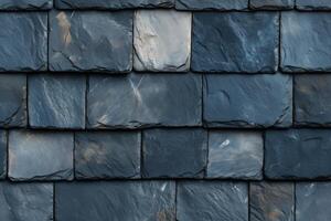 A close up of a slate roof with a dark blue color photo