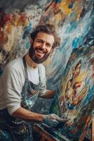 Portrait of a bearded man holding a paintbrush in his hand and smiling in front of a photo
