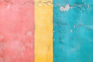 A textured wall featuring three vertical stripes in pink, yellow, and turquoise. The paint is peeling, revealing the underlying surface. photo
