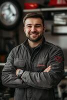 A man in a garage with his arms crossed photo