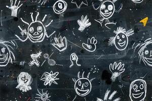 A blackboard with drawings of faces and hands photo