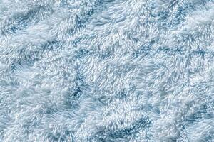 A close up of a fluffy blue shaggy rug photo