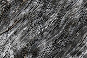 Textured wood gray surface with flowing, wavy patterns in shades of gray and black, resembling liquid metal or abstract art. photo