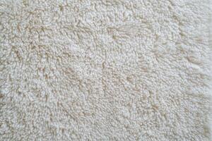 A close up of a white rug photo