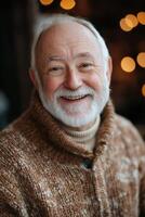 An older man with a beard and sweater smiling photo