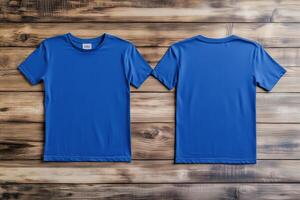 Two blue t - shirts on a wooden background photo