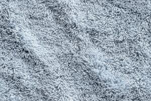 A close up of a fluffy white rug photo