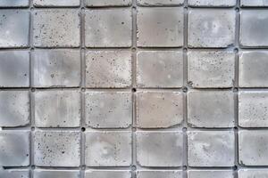 A close up of a white wall with a square pattern photo