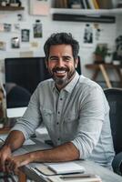 Portrait of a successful businessman sitting at his desk in his office photo