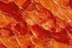 An abstract painting of orange and red paint photo