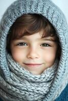 A young boy wearing a knitted scarf photo
