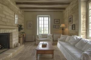 A living room with stone walls and a fireplace photo